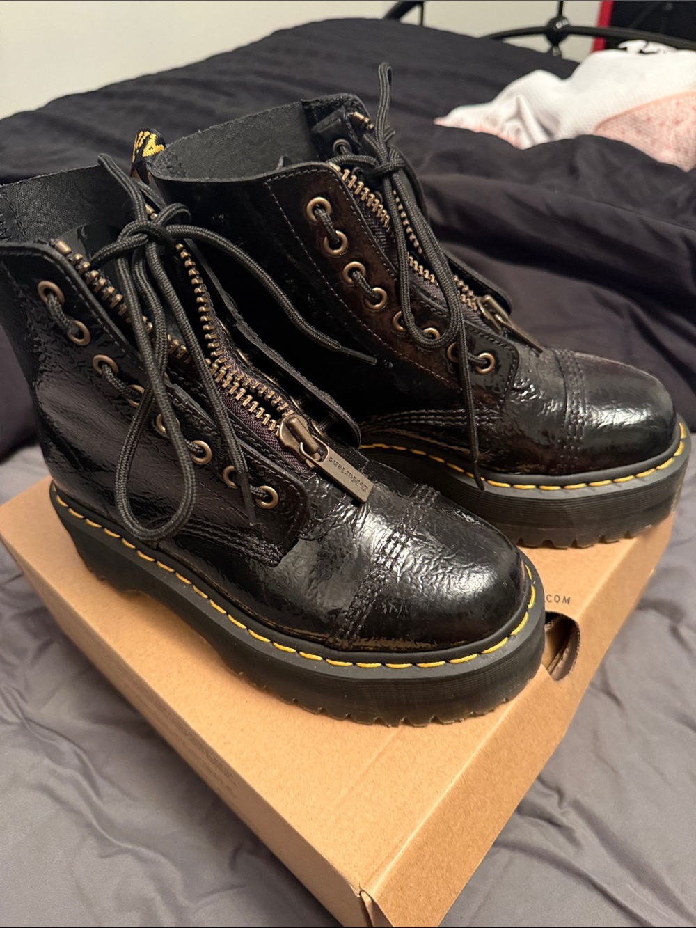 Dr. Martens Black Patent Combat Boots with Yellow Stitching